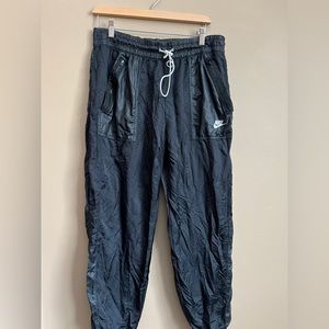 Nike trash bag style pants. Size Large.
